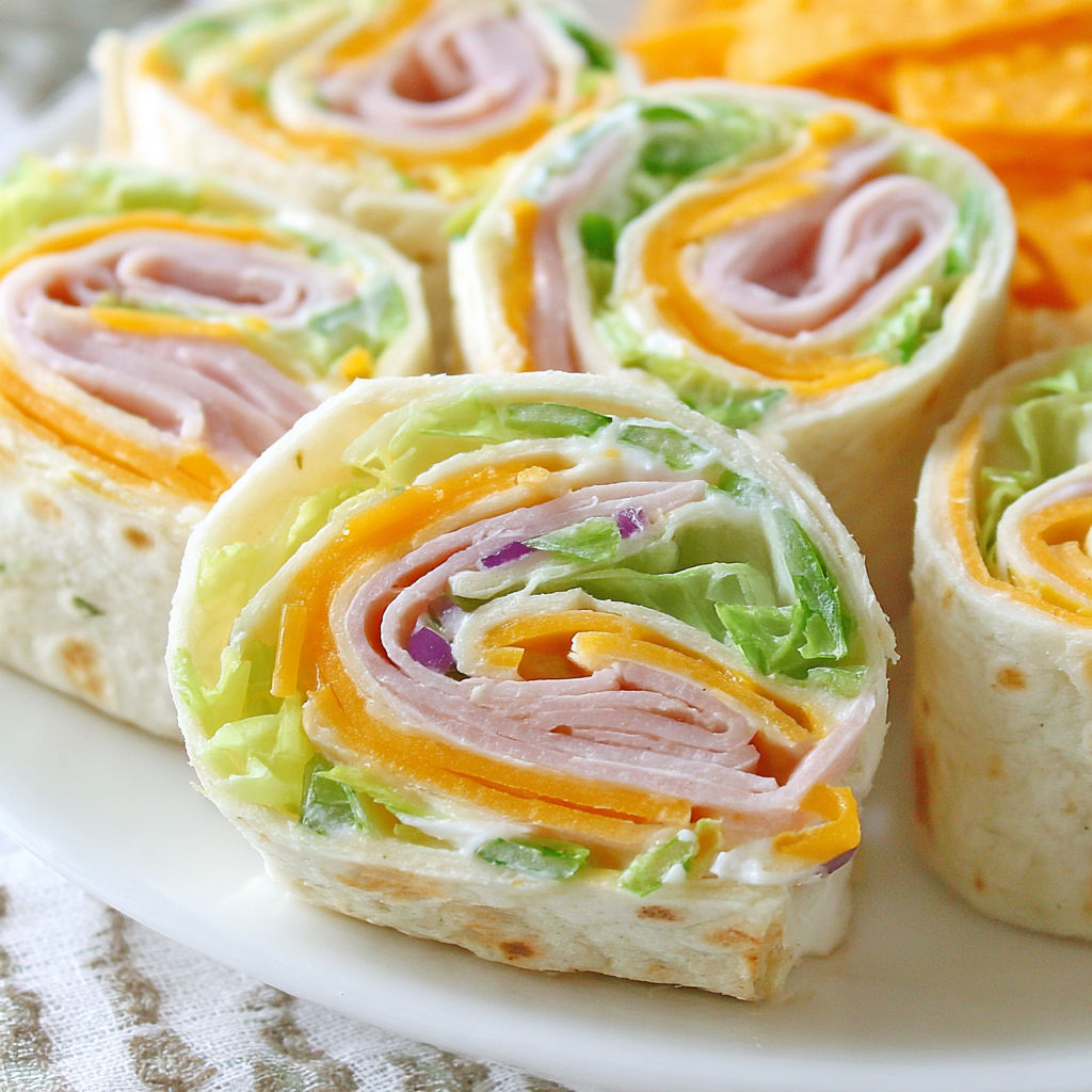 A plate of turkey roll ups.