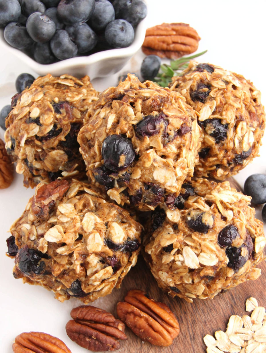 A stack of oatmeal cookies with blueberries.