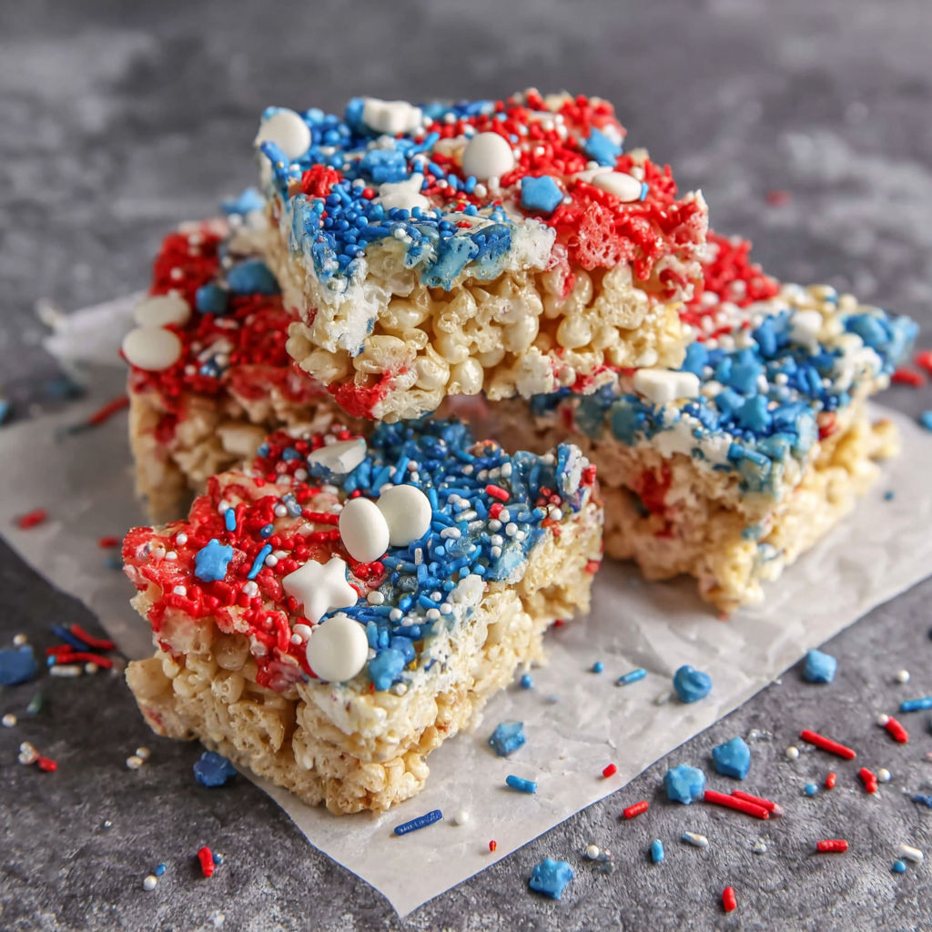Four Rice Krispie Treats with red, white, and blue colors.