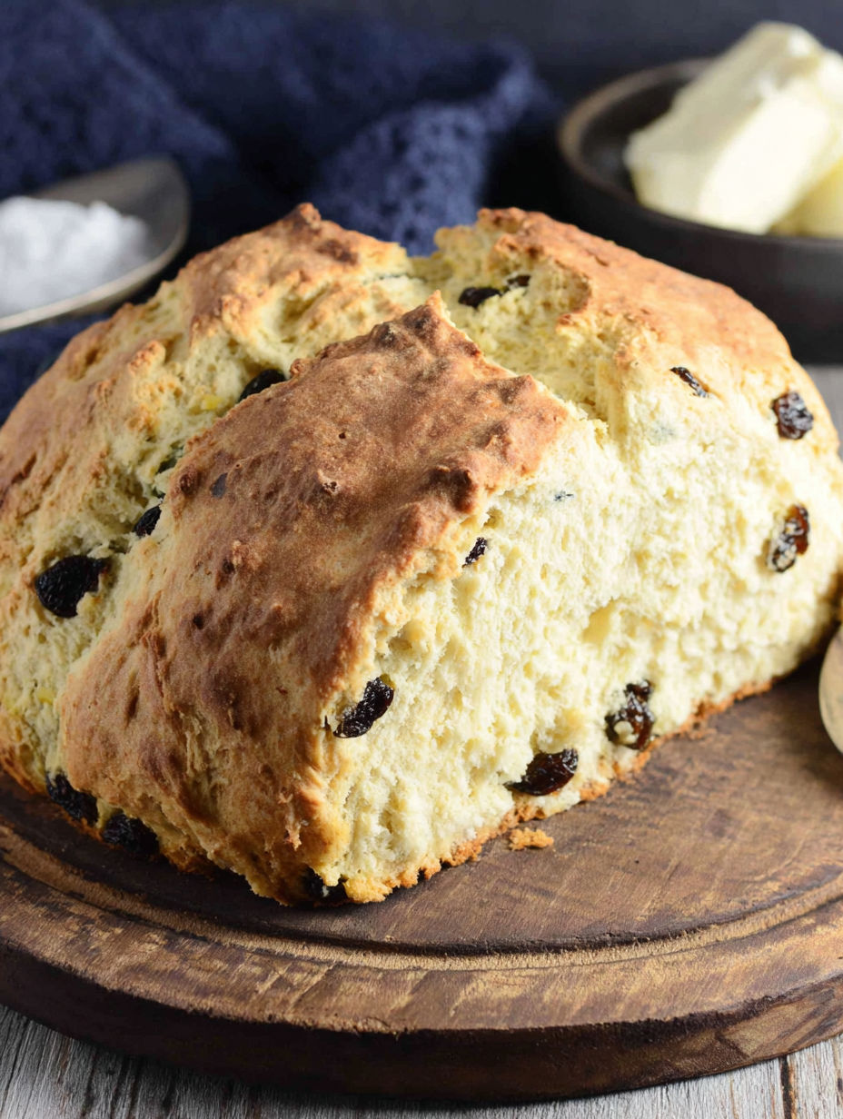 A slice of Irish soda bread with raisins.