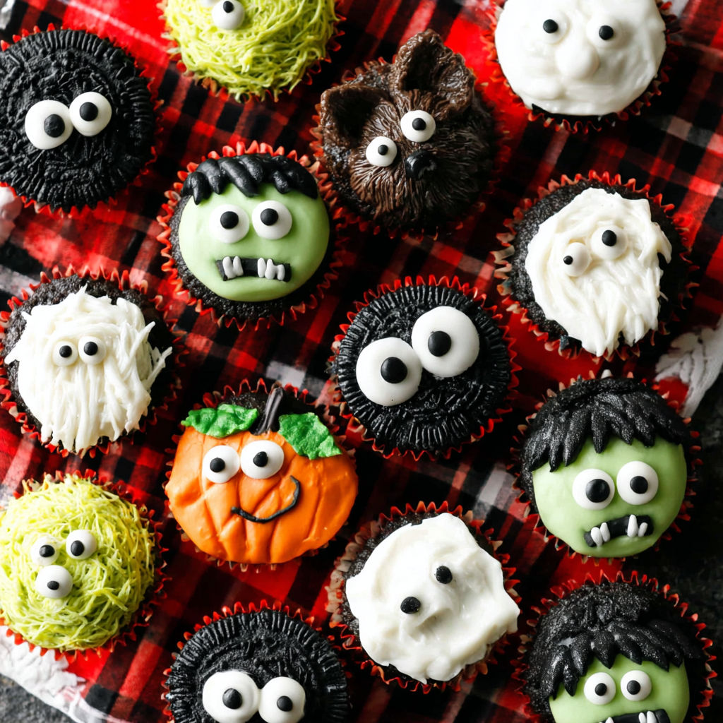 Halloween cupcakes with eyes and mouths.
