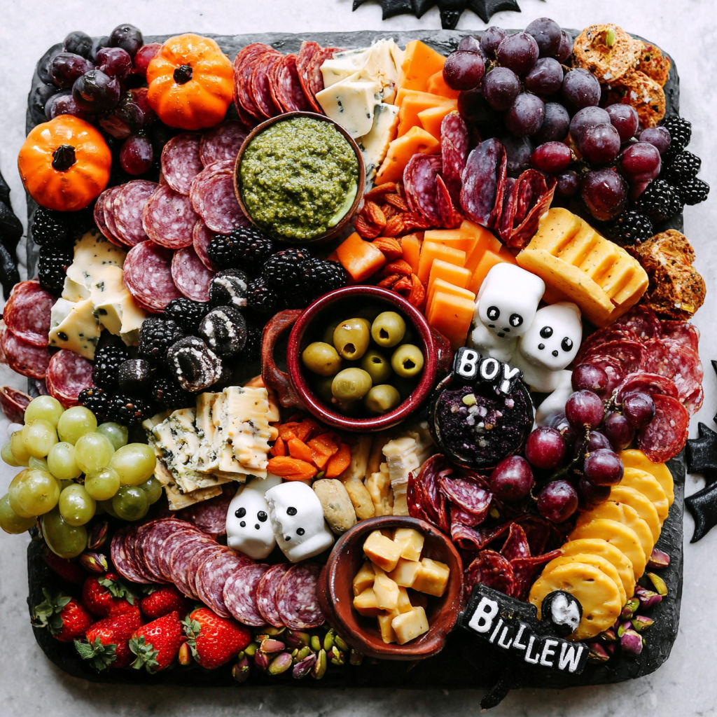 A Halloween charcuterie board with a variety of foods.