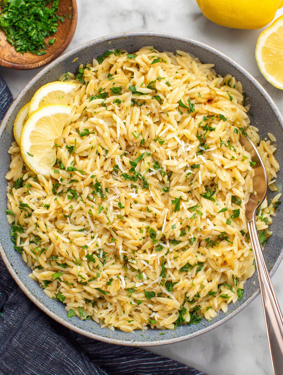 A bowl of rice with lemon and garlic.