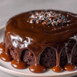 A chocolate cake with chocolate drizzle on top.