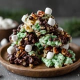 A stack of chocolate and mint no-bake clusters.