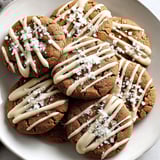A plate of gingerbread cookies with white icing.