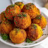 A plate of mashed potatoes and gravy.