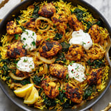 A plate of food with rice, chicken, and onions.