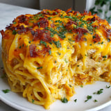 A plate of spicy southern cheesy chicken spaghetti casserole.