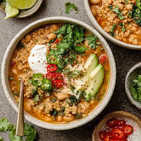 A bowl of turkey and white bean chili.