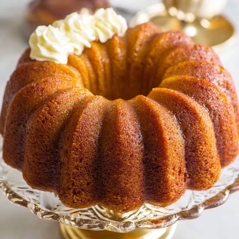 A slice of pumpkin rum cake on a plate.
