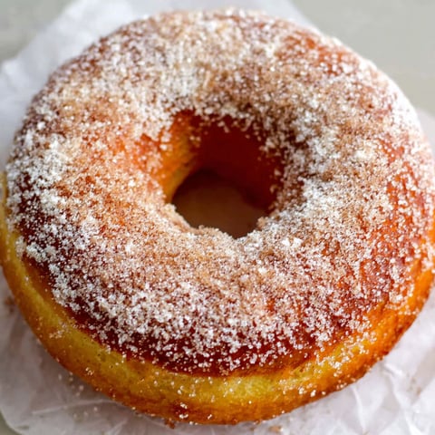 A doughnut cake with cinnamon sugar.