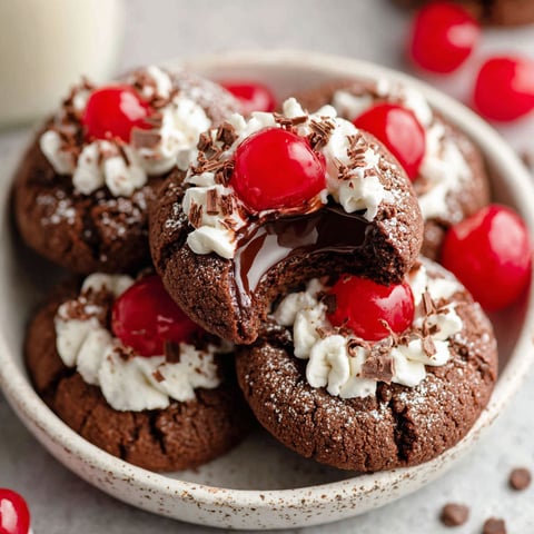 A plate of black forest thumbprint cookies.