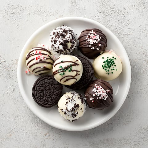 A plate of Christmas Oreo Truffles.