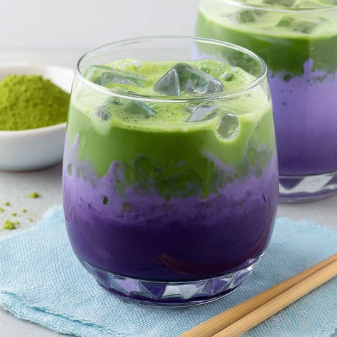 A glass of purple matcha ube latte.